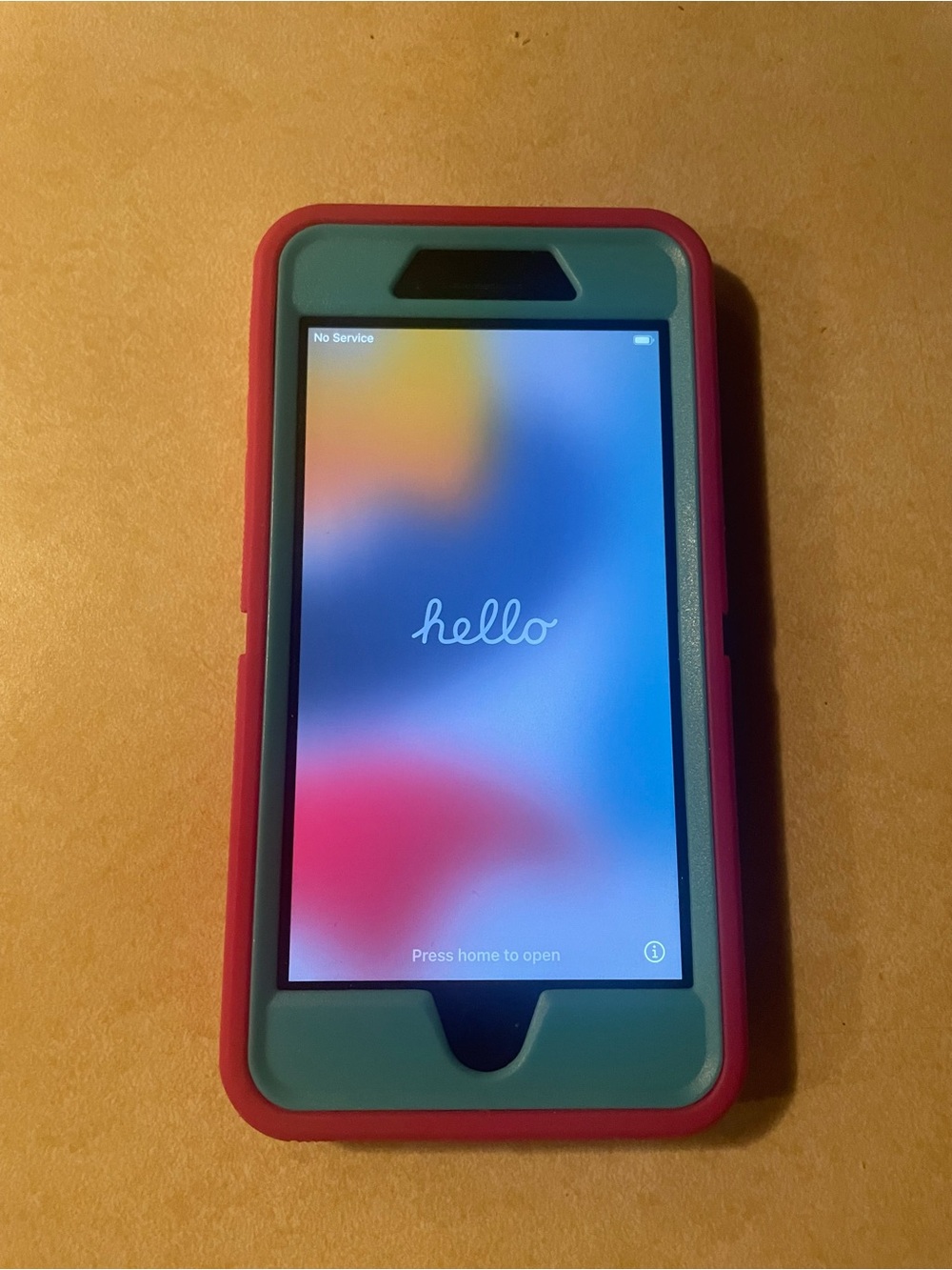 Apple IPhone 7 Plus with Pink and Teal Protective Phone Case with Front Frame.